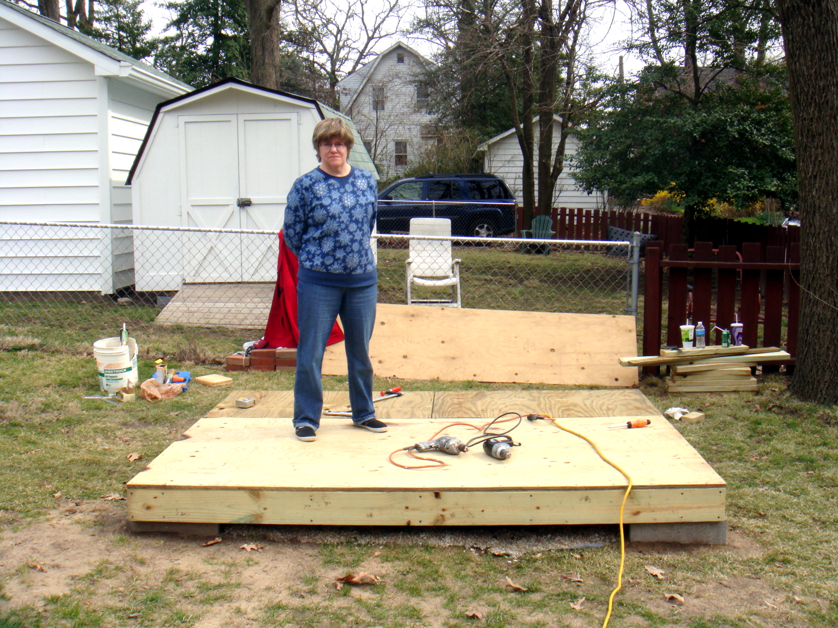 Tina standing on base of shed